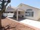 Backyard featuring a covered patio with seating, a grill, and low-maintenance landscaping at 7542 Mycroft Ct, Las Vegas, NV 89147