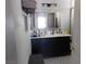Stylish bathroom featuring a double sink vanity with black hardware and patterned tile floors at 7542 Mycroft Ct, Las Vegas, NV 89147