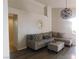 Inviting living room with a neutral color palette, hardwood floors, and a comfortable sectional sofa at 7542 Mycroft Ct, Las Vegas, NV 89147
