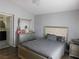 Serene main bedroom with a neutral color scheme, plush bedding, and access to an ensuite bathroom at 7542 Mycroft Ct, Las Vegas, NV 89147