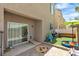 Covered backyard patio with play area, artificial turf, and paver patio at 7706 Crystal Village Ln, Las Vegas, NV 89113