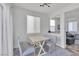Sunlit breakfast nook with table and bench seating, situated off the main living area at 7706 Crystal Village Ln, Las Vegas, NV 89113