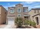 Charming two-story home featuring desert landscaping and a two car garage at 7706 Crystal Village Ln, Las Vegas, NV 89113