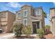 Inviting two-story home with desert landscaping and a quaint, covered entryway at 7706 Crystal Village Ln, Las Vegas, NV 89113