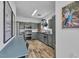 Modern kitchen with stainless steel appliances, ample cabinet space, and wood flooring at 7706 Crystal Village Ln, Las Vegas, NV 89113