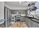 Well-appointed kitchen with stainless steel appliances, wood flooring, and ample storage at 7706 Crystal Village Ln, Las Vegas, NV 89113