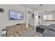 Comfortable living room featuring a large television and an open floor plan at 7706 Crystal Village Ln, Las Vegas, NV 89113
