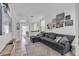 Cozy living room with a large sectional sofa and curated gallery wall at 7706 Crystal Village Ln, Las Vegas, NV 89113