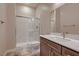 Bathroom featuring a glass enclosed shower, modern vanity and stylish fixtures at 7966 W Ford Ave, Las Vegas, NV 89113