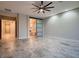 Bright bedroom featuring tile floors, recessed lights, and a sliding barn door to the bathroom at 7966 W Ford Ave, Las Vegas, NV 89113