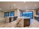 Open kitchen layout with double islands featuring marble countertops, stainless steel appliances, and modern fixtures at 7966 W Ford Ave, Las Vegas, NV 89113