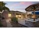 Well maintained backyard with a lounge area, covered patio and easy access to a swimming pool at 8209 Chapelle Ct, Las Vegas, NV 89131