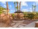 Secluded backyard patio featuring comfortable seating area, desert landscaping and ample privacy at 8209 Chapelle Ct, Las Vegas, NV 89131