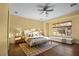 Bright bedroom featuring light walls, hardwood floors, and seating bench at 8209 Chapelle Ct, Las Vegas, NV 89131