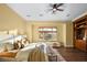 Comfortable bedroom with hardwood floors, lots of light and a built-in bookcase at 8209 Chapelle Ct, Las Vegas, NV 89131