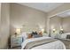Comfortable bedroom featuring a bed with stylish pillows, bedside tables, and a mirrored closet at 8209 Chapelle Ct, Las Vegas, NV 89131