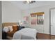 Well-lit bedroom featuring a comfortable bed, stylish décor, and a window for natural light at 8209 Chapelle Ct, Las Vegas, NV 89131