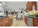 Open kitchen with stainless steel appliances, eat-in dining area, and views into the dining and living rooms at 8209 Chapelle Ct, Las Vegas, NV 89131
