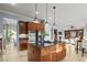 Bright open-concept kitchen with large island, stainless steel appliances, and eat-in dining area at 8209 Chapelle Ct, Las Vegas, NV 89131