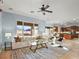 Bright living room showcasing a large sectional sofa, stylish decor, and seamless access to the backyard at 8209 Chapelle Ct, Las Vegas, NV 89131