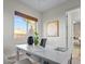 Bright office space featuring a white desk, modern decor, and natural light from a window with pleasant neighborhood view at 8209 Chapelle Ct, Las Vegas, NV 89131