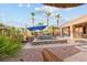 Relaxing backyard pool with spa, lounge chairs, mature palms and beautiful desert landscaping at 8209 Chapelle Ct, Las Vegas, NV 89131