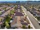 An elevated street view of a well-kept neighborhood with mature trees and manicured lawns at 8537 Highland View Ave, Las Vegas, NV 89145