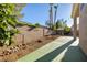 A green concrete patio connects to a rock and gravel area with desert landscaping and a charming gazebo at 8537 Highland View Ave, Las Vegas, NV 89145