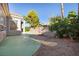 A spacious, private yard with lush greenery and concrete patio offers serenity and outdoor living at 8537 Highland View Ave, Las Vegas, NV 89145
