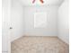 Clean and bright bedroom with neutral tile flooring, neutral paint, and standard window at 8537 Highland View Ave, Las Vegas, NV 89145