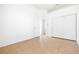 Bedroom with wood flooring, white walls, and a closet with sliding doors at 8537 Highland View Ave, Las Vegas, NV 89145