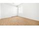 Bedroom with hardwood flooring, white walls, and a sliding door closet at 8537 Highland View Ave, Las Vegas, NV 89145