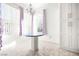 Cozy dining area with granite table, natural light and bright white walls at 8537 Highland View Ave, Las Vegas, NV 89145