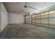 A spacious three car garage with bright lighting and an electric door opener at 8537 Highland View Ave, Las Vegas, NV 89145