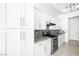 Updated kitchen with white cabinets, stainless steel appliances and granite countertops at 8537 Highland View Ave, Las Vegas, NV 89145