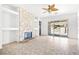 Bright living room with stone fireplace and sliding glass doors to backyard at 8537 Highland View Ave, Las Vegas, NV 89145