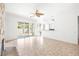 Open living room with sliding glass doors, tile flooring, and modern decor at 8537 Highland View Ave, Las Vegas, NV 89145