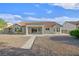 The backyard of this single-story home has low-maintenance landscaping and a covered patio at 8924 Signal Terrace Dr, Las Vegas, NV 89134