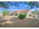 The backyard features low-maintenance landscaping with mature trees and a covered patio at 8924 Signal Terrace Dr, Las Vegas, NV 89134