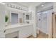 Bright bathroom featuring a marble vanity, large mirror, and walk-in shower at 8924 Signal Terrace Dr, Las Vegas, NV 89134