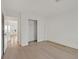 Bedroom with light wood floors, and white closet at 8924 Signal Terrace Dr, Las Vegas, NV 89134