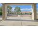 A covered patio features a concrete floor, textured pillars, and a view of the low-maintenance backyard at 8924 Signal Terrace Dr, Las Vegas, NV 89134