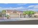 Charming single-story home featuring a well-maintained front yard and attached two-car garage at 8924 Signal Terrace Dr, Las Vegas, NV 89134