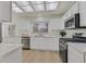 Modern kitchen featuring white cabinets, stainless steel appliances, and beautiful countertops at 8924 Signal Terrace Dr, Las Vegas, NV 89134