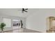 Bright living room with modern laminated floors, vaulted ceilings, and neutral color palette at 8924 Signal Terrace Dr, Las Vegas, NV 89134