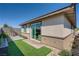 Backyard featuring low-maintenance landscaping, artificial turf, and access to the home at 9357 Aria Ridge Ave, Las Vegas, NV 89143
