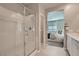 A modern bathroom with walk in shower next to bedroom at 9357 Aria Ridge Ave, Las Vegas, NV 89143