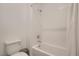 Bright bathroom featuring a tiled shower-tub combination and modern fixtures at 9357 Aria Ridge Ave, Las Vegas, NV 89143