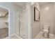 Modern bathroom with walk-in shower, toilet, and walk-in closet at 9357 Aria Ridge Ave, Las Vegas, NV 89143