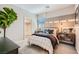 Comfortable bedroom features neutral décor and a well-lit walk-in closet at 9357 Aria Ridge Ave, Las Vegas, NV 89143